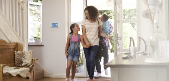 family-entering-house